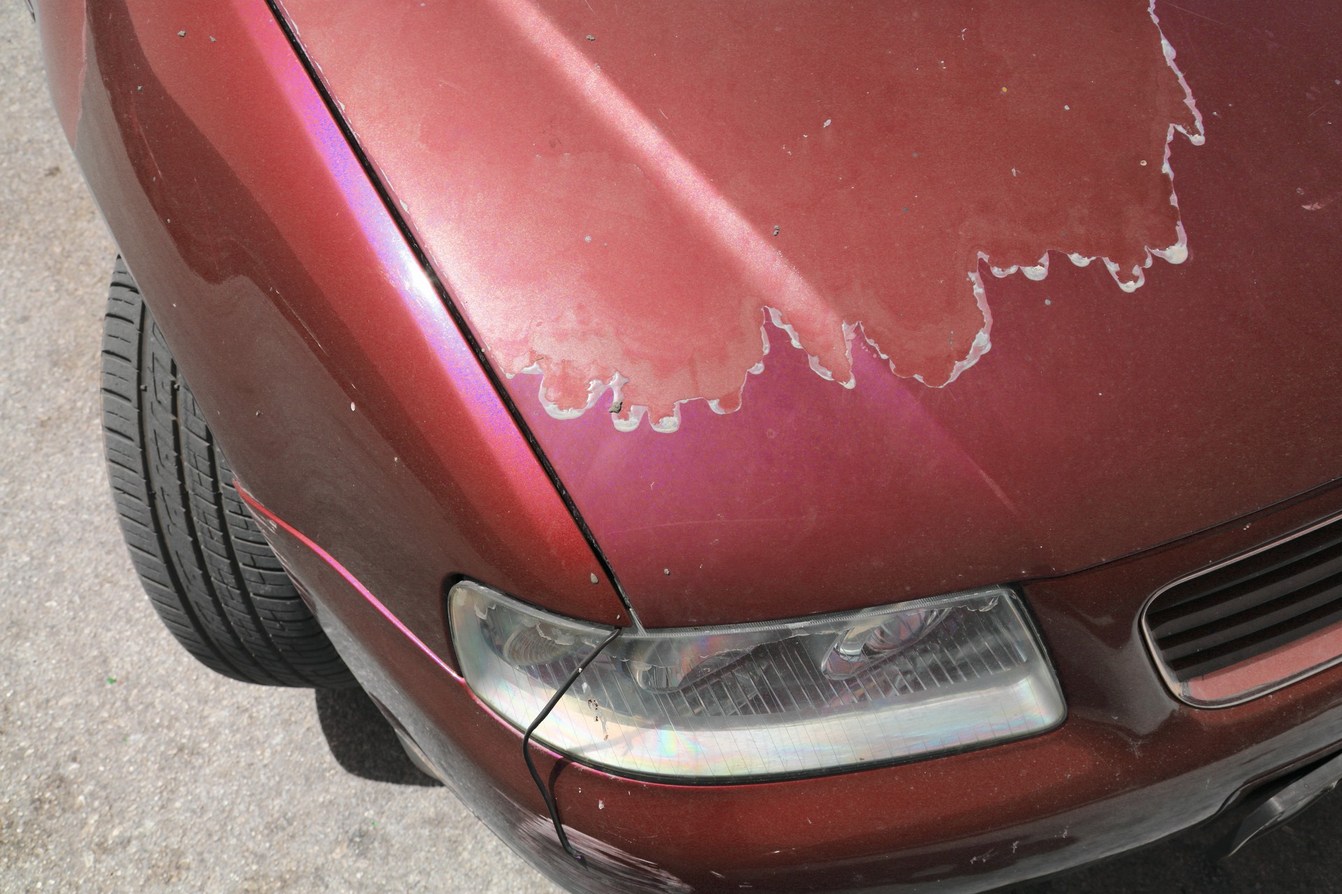 Sun weathered car paint surface